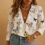 Elegant butterfly print blouse with ruffle sleeves for women, featuring a light tailored fit and stylish feminine design.