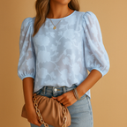 Women’s floral top with elegant pattern and flattering fit, ideal for both casual and formal occasions.
