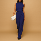 Women’s halter-neck wide leg jumpsuit with bow and pockets, ideal for summer evenings, parties, and stylish gatherings.