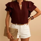 Women’s sleeveless blouse with elegant tailored fit and lightweight fabric, ideal for work and casual chic occasions.