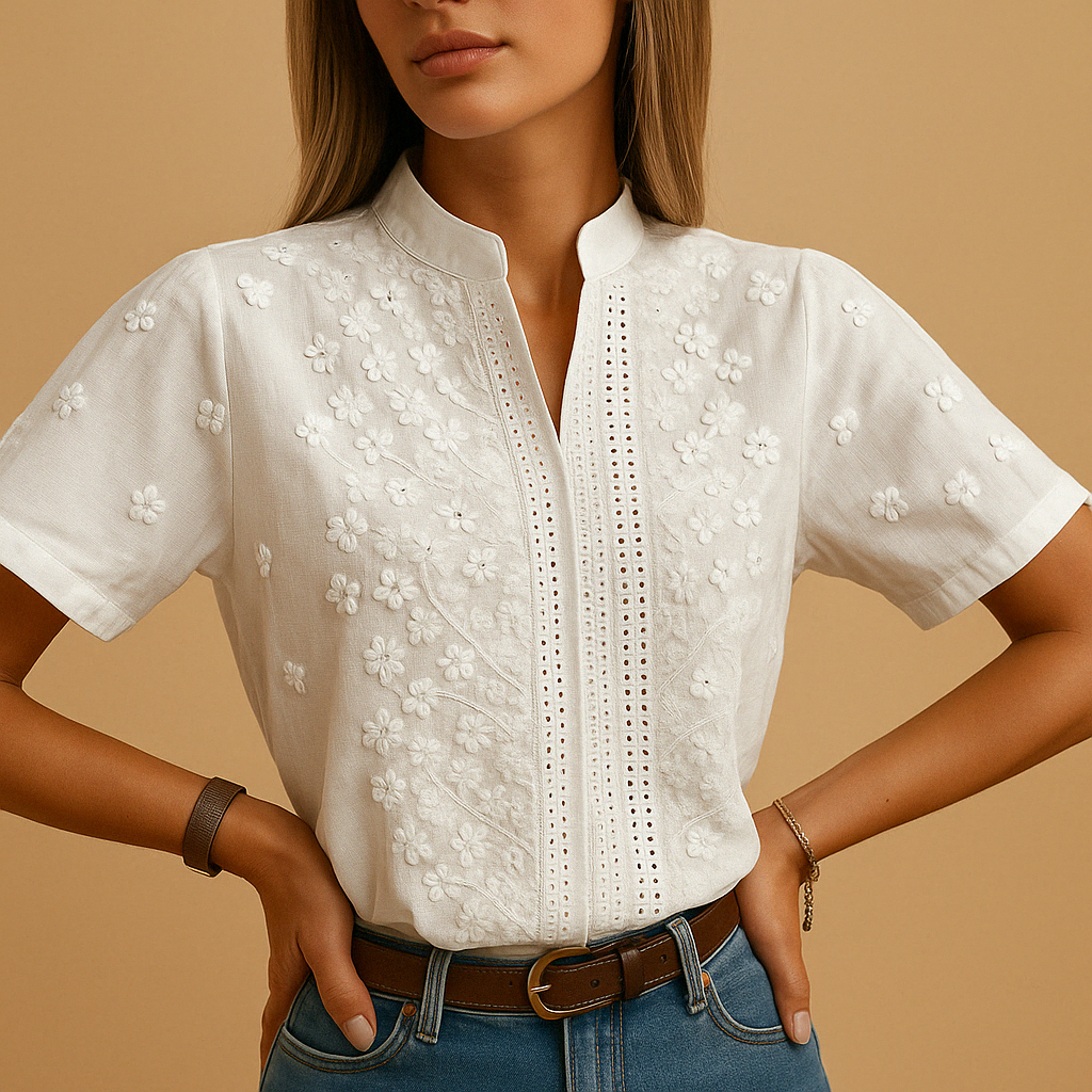 Women’s white blouse with tailored fit, classic collar, and button closure, perfect for work, casual days, or evening occasions.