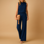 Elegant women’s jumpsuit with wide legs and round neckline in pink, red, blue, or black, perfect for work or stylish evenings out.