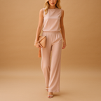 Elegant women’s jumpsuit with wide legs and round neckline in pink, red, blue, or black, perfect for work or stylish evenings out.